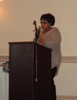 Alisha Knight, Project Director, welcomes grandparents and guests to the luncheon. 
