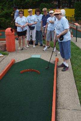 Anna Browne hopes for a hole-in-one in Miniature Golf at Putt Putt.