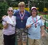 Helena Cribb, Linda Zappacosta, and Linda Desiderio proudly wear their medals.