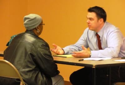 Christopher Murphy, elder law attorney from Pappano & Breslin law firm, meets with client.