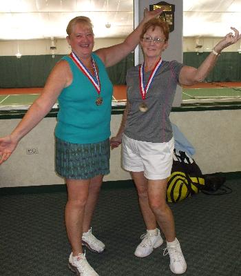 Tennis medalists strike a pose.