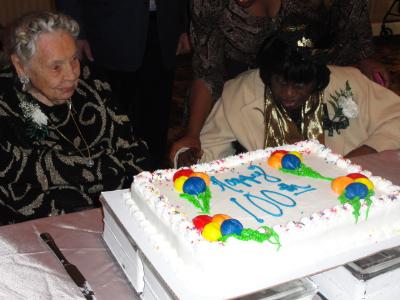 Marion Roth, of White Horse Village,who will turn 105 on November 11 and Nancy Fisher, of Manor Care Yeadon, who will turn 109 on December 23 with the birthday cake honoring all 2013 Delaware County centenarians.