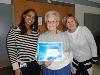 Christy Bobo (left), Housing Director at COSA, raffle winner Jeane Brower (center), of Brookhaven, and Joana Geiger (right) Link coordinator. 