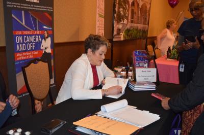 Special guest, Lisa Thomas-Laury, signs copies of her book.