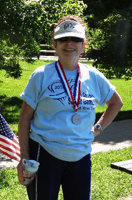 Maggie Magee and her gold medal for Women's Doubles Horseshoes.