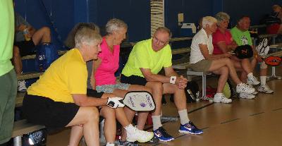 Discussing strategy at Pickleball