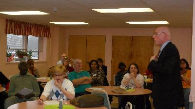 Caregivers listen as Dr. Barry Jacobs, Psy.D. presents "Communication Strategies for Managing Difficult Behaviors."