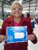 Barbara Johnson, of Upper Chichester, displays her prize-a $125 PECO voucher to be used toward utility payment.